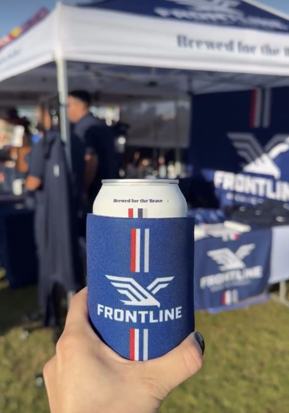 A Frontline koozie at the Frontline festival tent